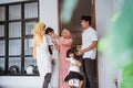 excited family visiting friend during eid fitri mubarak at home Royalty Free Stock Photo