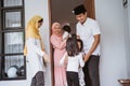 excited family visiting friend during eid fitri mubarak at home Royalty Free Stock Photo