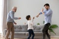 Happy three generations of men have fun at home together Royalty Free Stock Photo