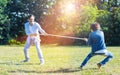 Excited father and son playing tug of war together Royalty Free Stock Photo