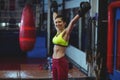 Excited female boxer posing after victory