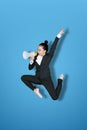 Excited female manager shouting on a megaphone