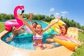 Excited friends playing pool games in summer Royalty Free Stock Photo