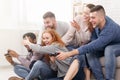 Excited friends playing video games together, having fun Royalty Free Stock Photo