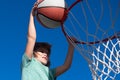 Excited funny kid playing basketball. Closeup child portrait. Funny child face. Little basketball player making slam