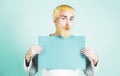 Excited funny man holding empty white board. Advertising. Copy space on paper. Man holding a blank billboard isolated on Royalty Free Stock Photo