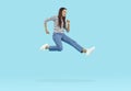 Excited funny young woman jumping and running at high speed in hurry to get crazy discounts.