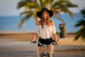 Excited girl in black floppy hat holding handlebar Royalty Free Stock Photo