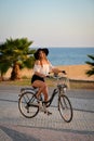 Excited girl in black floppy hat holding handlebar Royalty Free Stock Photo