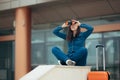 Excited Travel Woman Holding Binoculars and Suitcase