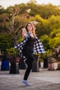 Excited girl dancing and listening music with headphones smart phone in the street Royalty Free Stock Photo