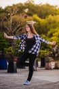 Excited girl dancing and listening music with headphones smart phone in the street Royalty Free Stock Photo