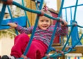 Excited girl developing dexterity at playground