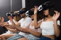 Excited girl is experiencing with friends virtual reality