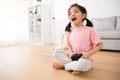 Excited girl kid playing video game at home Royalty Free Stock Photo