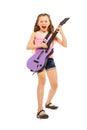 Excited girl with long hair playing on guitar