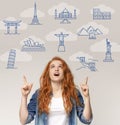 Excited girl pointing upwards at tourist destinations icons, gray background