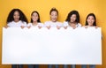 Excited Girls Holding Empty Poster For Text, Yellow Background, Mockup