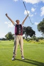 Excited golfer cheering and looking at camera Royalty Free Stock Photo