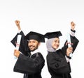 Excited graduate boy and girl in toga holding certificates