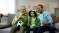 Excited grandpa, dad and son happy for national football team winning game, home
