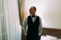 Excited groom posing standing in doorcase of hotel room Royalty Free Stock Photo