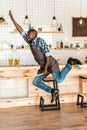 excited handsome african american worker having fun and jumping with broom Royalty Free Stock Photo