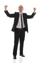 Excited handsome business man with arms raised in