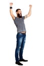 Excited handsome Tattooed bearded man with arms raised Royalty Free Stock Photo