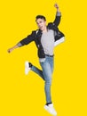 Excited handsome  young man in casual clothes jumping and dancing Royalty Free Stock Photo
