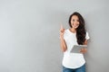 Excited happy asian woman holding tablet computer Royalty Free Stock Photo