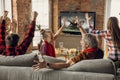 Excited, happy big family team watch sport match together on the couch at home Royalty Free Stock Photo