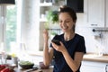 Excited happy chef blogger girl reading message with good news Royalty Free Stock Photo