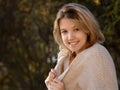 Excited happy fall woman smiling joyful outside in colorful fall forest. Beautiful Caucasian young woman Royalty Free Stock Photo