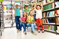 Excited happy laughing children in library