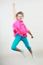 Excited happy little girl kid jumping for joy. Royalty Free Stock Photo