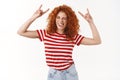 Excited happy lively attractive redhead curly-haired woman enjoy summer positive vibes awesome music show tongue playful