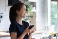 Excited happy smartphone user woman holding mobile phone