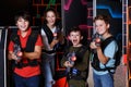 Teen kids with laser guns during lasertag game Royalty Free Stock Photo