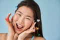 Girl wearing colorful accessorizes posing with funny joyful face expression