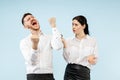 Excited happy young couple looking at camera with delight amazed by unbelievable great sale Royalty Free Stock Photo