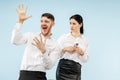 Excited happy young couple looking at camera with delight amazed by unbelievable great sale Royalty Free Stock Photo