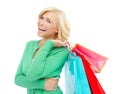 Excited about her shopping spree. An excited young woman holding shopping bags while isolated on a white background. Royalty Free Stock Photo