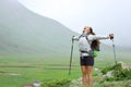 Excited hiker celebrating her healthy life in nature