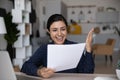 Excited Indian student girl receiving admission letter from business school