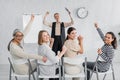 excited interracial businesswomen and speaker with Royalty Free Stock Photo