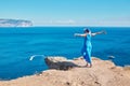 Excited lady enjoying sea view from cliff. Seascape and holiday idea. Travel time and relax time concept, copy space Royalty Free Stock Photo