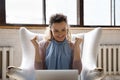 Excited laptop user looking at display with winner yes gesture Royalty Free Stock Photo