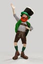 Excited leprechaun in green suit with red beard on white background