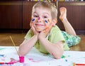 Excited little boy painting